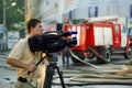The reporter reports on the fire in the building from the scene Royalty Free Stock Photo