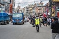 Reporter walking down the street with protesters in Kathmandu