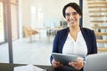 Reports show that my business has been doing exceptionally well. Portrait of a confident young businesswoman working on Royalty Free Stock Photo