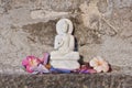 Representation of Buddha, stone carving, with flowers, India