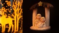 Representation of a Christmas nativity scene with the figures of baby Jesus, Mary and Joseph on a black background. Christmas Royalty Free Stock Photo