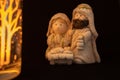 Representation of a Christmas nativity scene with the figures of baby Jesus, Mary and Joseph on a black background. Christmas Royalty Free Stock Photo