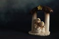 Representation of a Christmas nativity scene with the figures of baby Jesus, Mary and Joseph on a rock background. Phrase space on Royalty Free Stock Photo