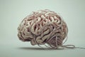 Representation of a cluttered mind with tangled wires forming a realistic human brain shape conveying complex thoughts