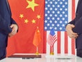 Representatives of China and America in negotiations on terms of ongoing trade war.