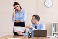 Discontented Businessman Giving Warning Female Employee For Incompetence In Office