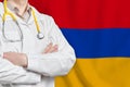 Republic of Armenia healthcare concept with doctor on background. Medical insurance, work or study in the country