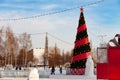 Republic Of Bashkortostan, Russia - December 24, 2019. City service workers install and decorate a Christmas tree on a city street