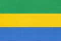 Republic of Gabon national fabric flag, textile background. Symbol of african world country