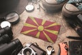 Republic of Macedonia Flag Between Traveler`s Accessories on Old Vintage Map. Tourist Destination Concept Royalty Free Stock Photo