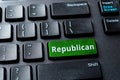 Republican green key on a black laptop keyboard. United States elections, voting online for Republican party, politics concept. Royalty Free Stock Photo