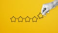 Reputation management. Customer Experience Concept. Woman hand puts five star excellent rating, copy space Royalty Free Stock Photo