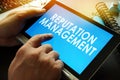 Reputation management on a screen of tablet. Royalty Free Stock Photo