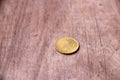 REPVBBLICA ITALIANA, Aluminium-Bronze Coin of Italy on the wooden floor.