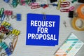Request For Proposal text on stick note with stationery on concrete background Royalty Free Stock Photo