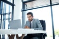 This requires my undivided attention. a professional businessman sitting at his desk. Royalty Free Stock Photo