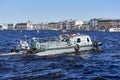 A rescue boat for divers floats down the river, the water blocks the water line Royalty Free Stock Photo