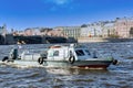 A rescue boat for divers floats down the river, the water blocks the water line Royalty Free Stock Photo