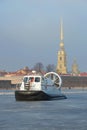 The rescue boat of Emercom of Russia `Hivus-20` against the background of Peter and Paul Cathedral on ice of the frozen Neva Royalty Free Stock Photo