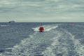 Rescue boat sailing in a dark blue sea Royalty Free Stock Photo