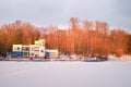 Rescue boat station on the water in winter under the snow