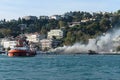 Rescue boats put out a fire on a passenger ship in the Bosphorus Royalty Free Stock Photo