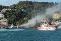 Rescue boats put out a fire on a passenger ship in the Bosphorus Royalty Free Stock Photo