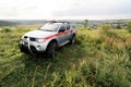 A rescue car stands in the middle of the field in summer Royalty Free Stock Photo