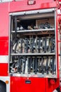 Rescue fire truck equipment. Compartment of rolled up fire hoses on a fire engine