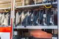 Rescue fire truck equipment. Compartment of rolled up fire hoses on a fire engine