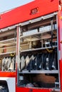 Rescue fire truck equipment. Compartment of the rolled up fire hoses on a fire engine