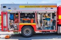 Rescue firetruck vehicle with open hatches displaying different equipment.