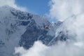 Rescue helicopter over big clouds, Gorak Shep, Everest Base Camp trek, Nepal
