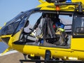 Rescue helicopter over the mountains to help hikers. First aid helicopter. Close-up to the cabin. Doors open