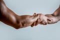 Rescue, helping gesture or hands. Strong hold. Close-up. Two hands, helping hand of a friend. Handshake, arms Royalty Free Stock Photo