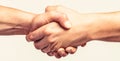 Friendly handshake, friends greeting, teamwork, friendship. Close-up. Rescue, helping gesture or hands. Strong hold. Two Royalty Free Stock Photo