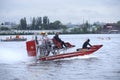 Rescue operations on a river. Rescue motorboat with lifeguards aboard floating on the water