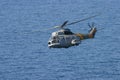 Airbus Superpuma helicopter rescue maneuvers inflight over mediterranean Royalty Free Stock Photo