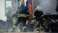 Rescue Team of Firefighters Arrive on the Car Crash Traffic Accident Scene on their Fire Engine. F Royalty Free Stock Photo