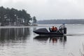 A rescue team is sailing on a hovercraft to rescue fishermen on the ice