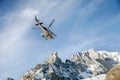 A rescue helicopter over mountains