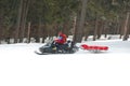 Rescue worker on snowmobile