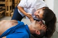 Rescuer assiting unconscious man Royalty Free Stock Photo