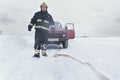 Rescuer at the broken red car Royalty Free Stock Photo