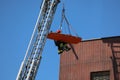 Rescuer Firefighter with the stretcher on the aerial platform of Royalty Free Stock Photo