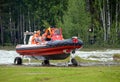 Rescuers on the amphibious boat `SEALEGS` on the range of the Noginsk rescue center EMERCOM of Russia. Royalty Free Stock Photo