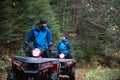 Rescuers Doing Lookout in Woods on a Quad