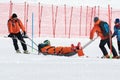 Rescuers evacuated injured skier sportsman from mountain on rescue stretchers