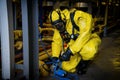 Rescuers in a radiation protection suit