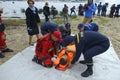 Rescuers team carrying sufferer on a stretcher helping him to get to the first aid post, training Royalty Free Stock Photo